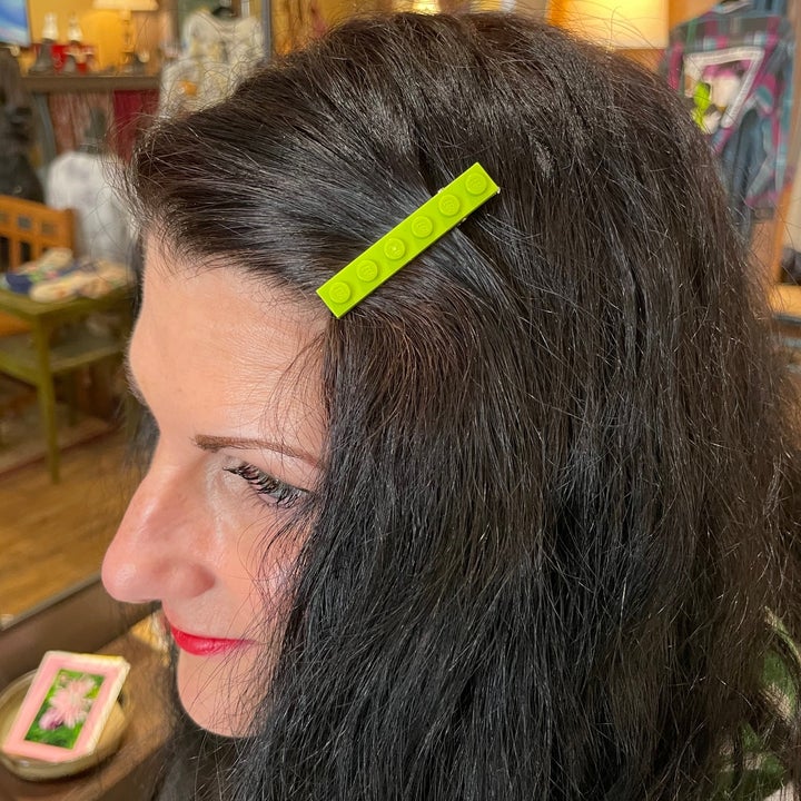 example of how to wear kb lego 1x6 barrette. color shown: lime green